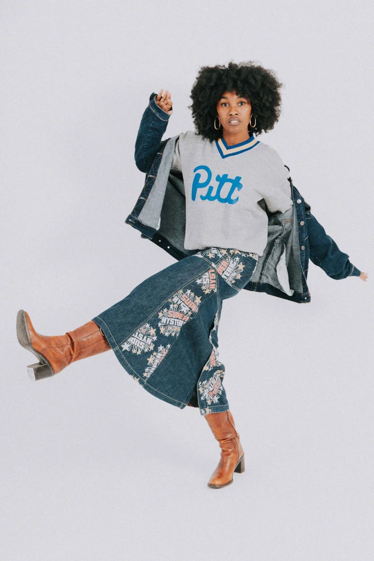 An editorial streetwear portrait in patterned denim