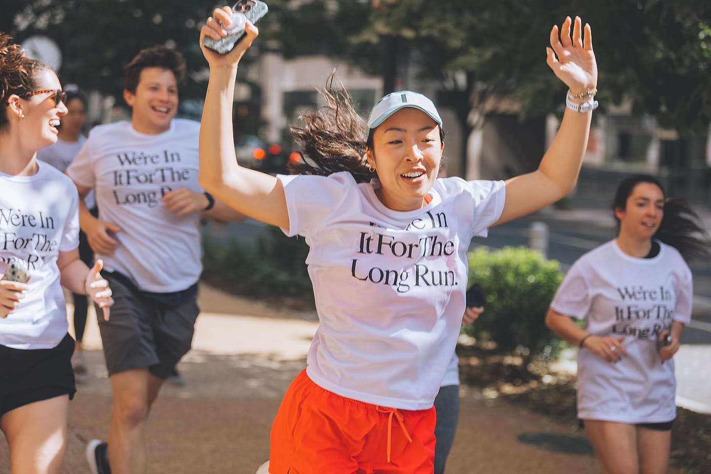 Wedding guests run in matching tees at a Washington DC wedding-weekend fun run