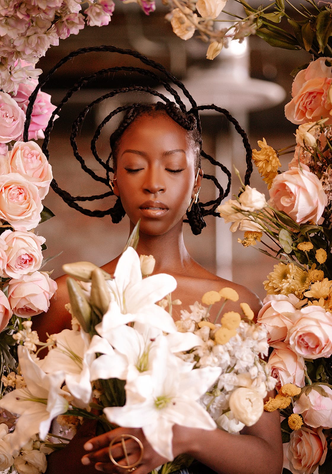 A beauty portrait surrounded by pink and yellow flowers